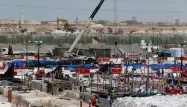 Actuellement, près de 26.000 travailleurs participent à la construction ou à la rénovation des huit stades prévus par le Qatar pour la Coupe du monde.