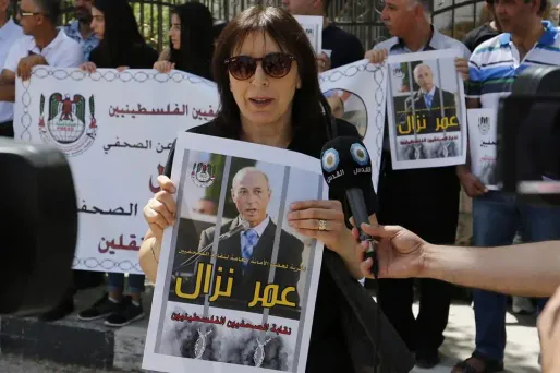 Ici lors d'une manifestation pour réclamer la libération du journaliste. Le journaliste palestinien Omar Nazzal, a annoncé mardi avoir été libéré par la justice militaire israélienne à l'issue de dix mois de détention.